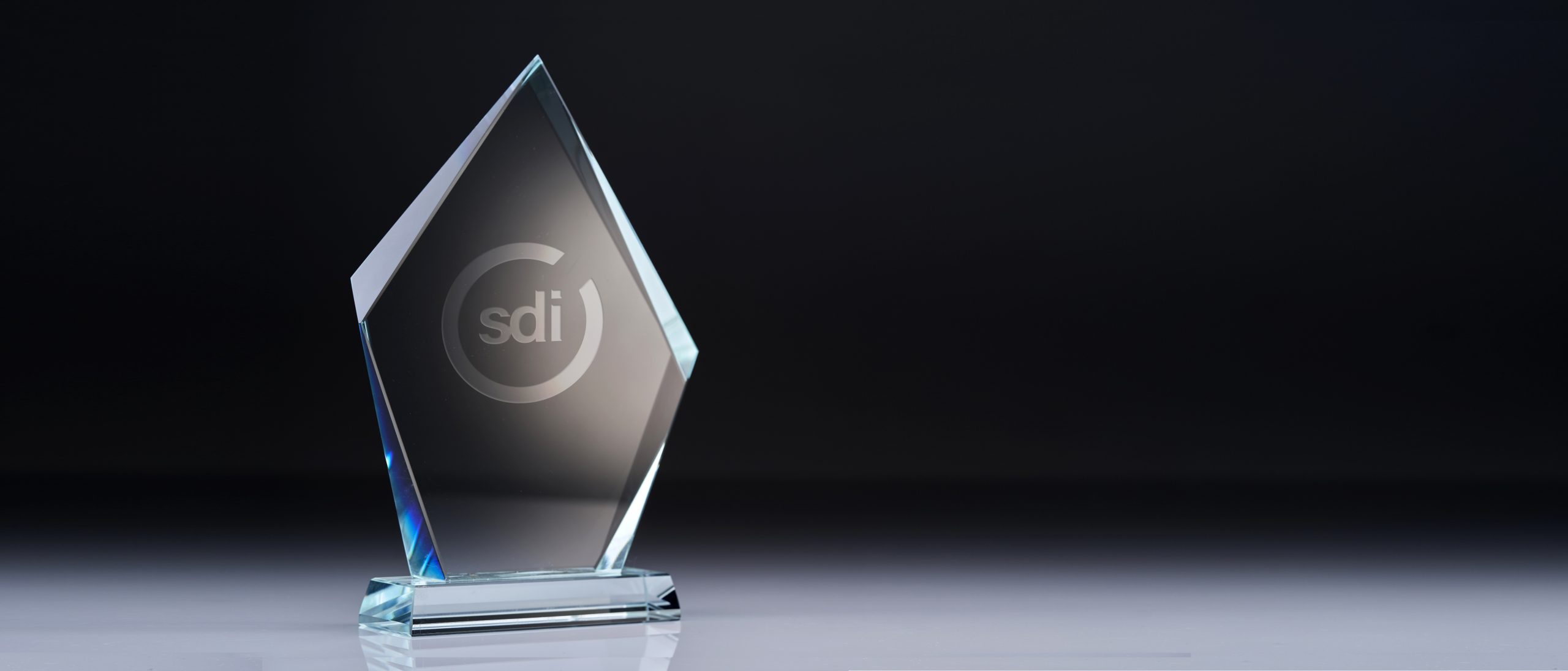 An award with an SDI logo on a black background - training and talent development